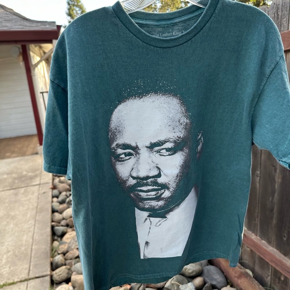 MLK purpose, green fade tag size “larger” medium quote on the back.